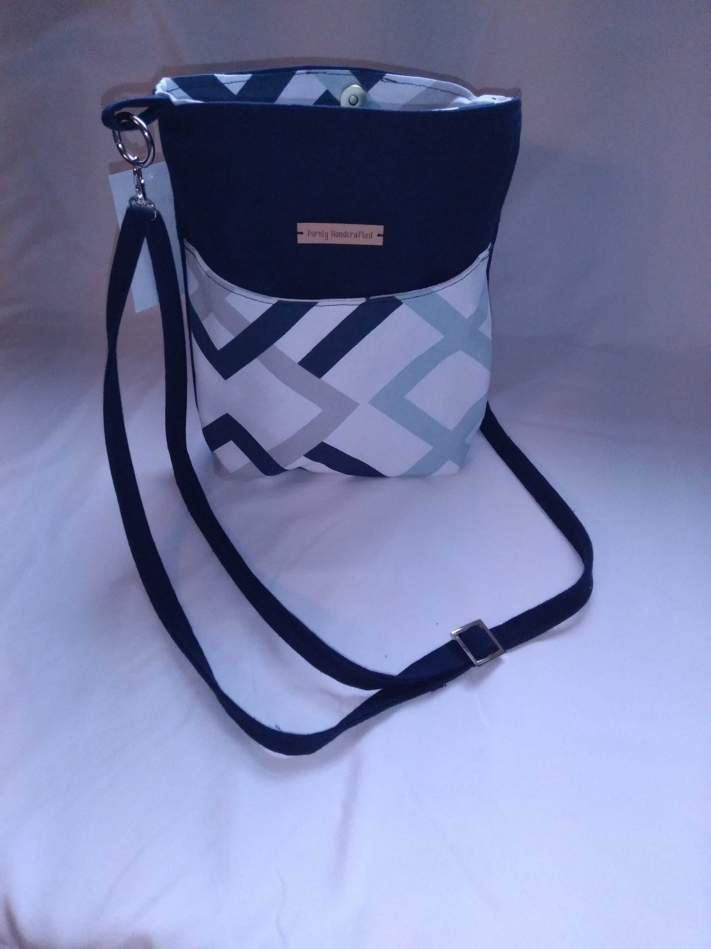 navy blue geometric canvas crossbody bag