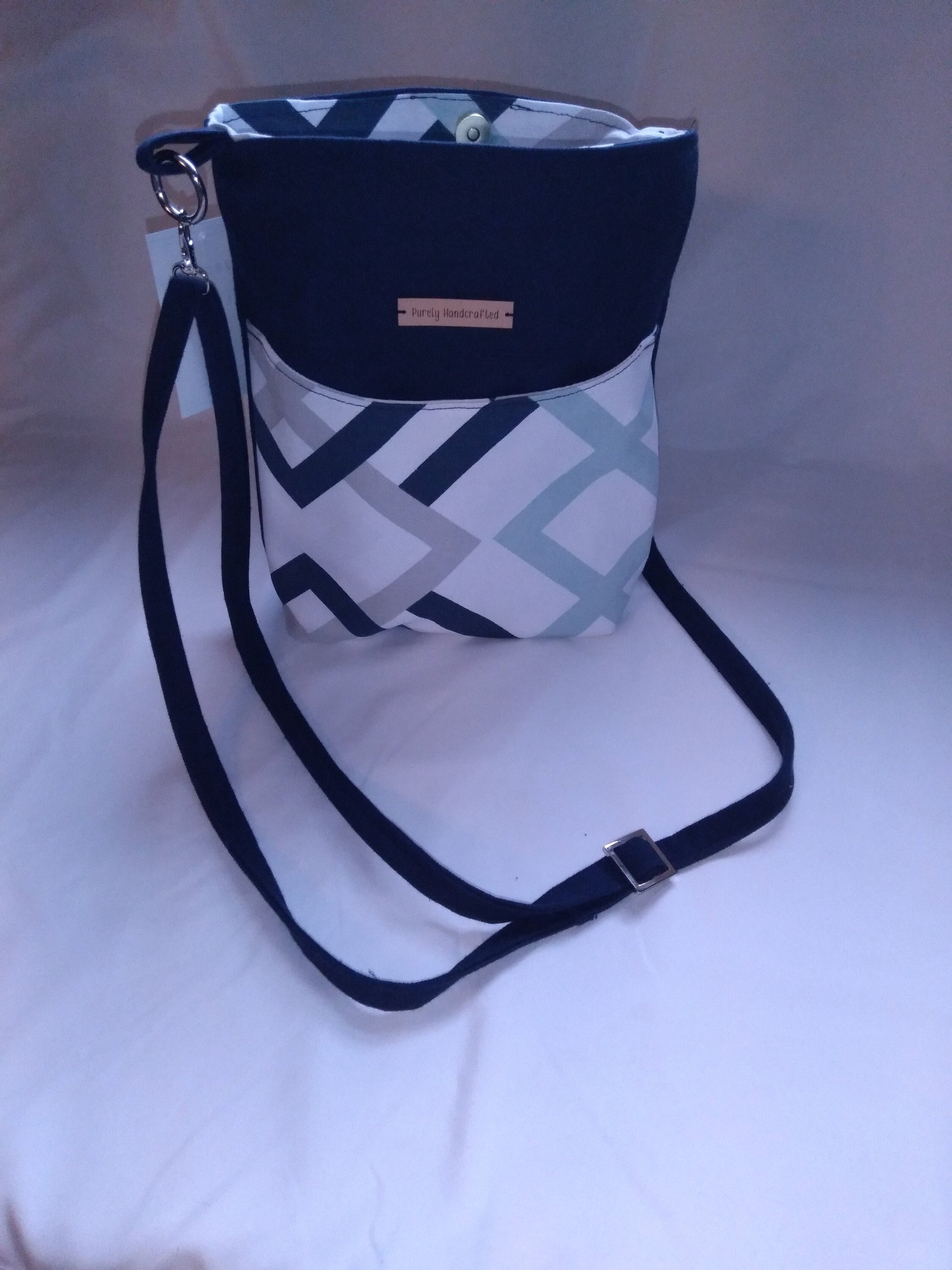 navy blue geometric canvas crossbody bag