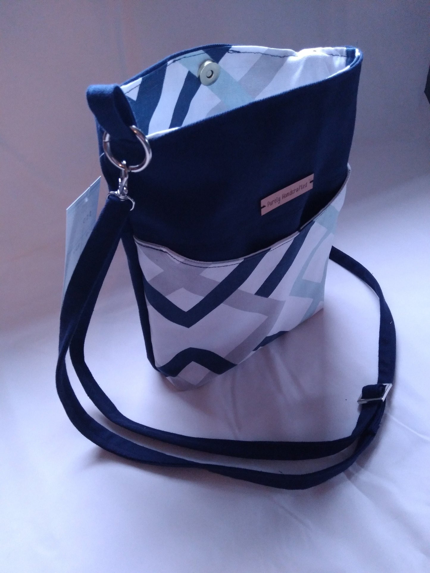 navy blue geometric canvas crossbody bag